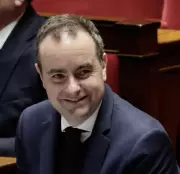 French Prime Minister Survives No-Confidence Vote on Forced Budget