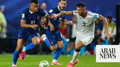 Mbappe double sends France into knockout rounds after weather delay